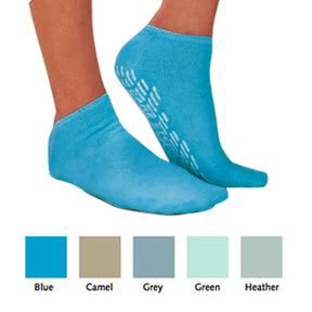 Blue non-slip grip socks on feet, with swatch options in blue, camel, grey, green, and heather.