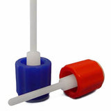 Close-up of two urine specimen collection swabs with blue and red caps on white background.