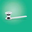 Clear plastic medical device with a flat circular base and extended handle on green background
