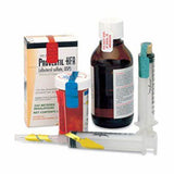 Medical supplies including inhaler box, prescription bottles, liquid medicine, and syringes.