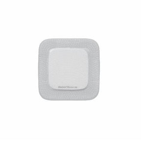 Square sterile adhesive wound dressing with white border on plain background