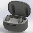Rechargeable hearing aids in a black charging case, home medical device