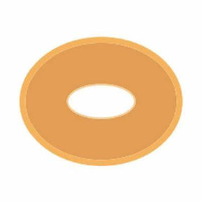 beige medical adhesive barrier ring with central hole, ostomy supplies on white background