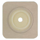 Square beige ostomy barrier with central cut-out, used for stoma care and medical supply needs