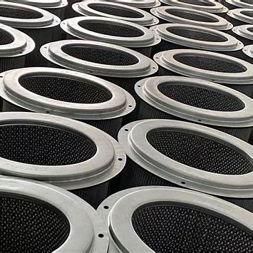 Close-up of multiple industrial air filters arranged in rows, metal rims and mesh visible