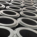 Close-up of multiple industrial air filters arranged in rows, metal rims and mesh visible