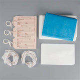 Home medical supply kit with ID tags, blue underpad, gauze wraps, and absorbent pads