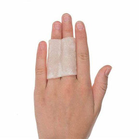 Hand wearing medical bandage pad for wound care and protection on fingers