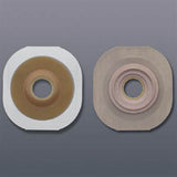 Two ostomy barrier baseplates with adhesive backing for medical stoma care on gray background