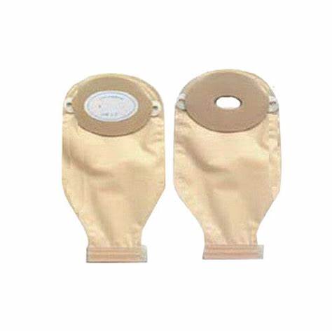 Two beige ostomy bags with adhesive flanges for medical use, displayed on white background.