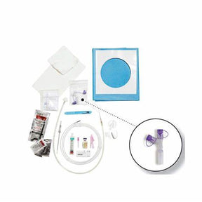 Tube feeding kit with extension set, syringes, dressings, and medical supplies on white background