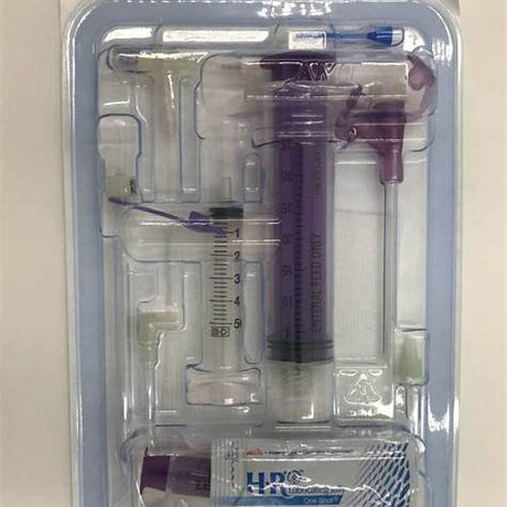Medical syringe kit with feeding tube and lubricant in sterile packaging for home care