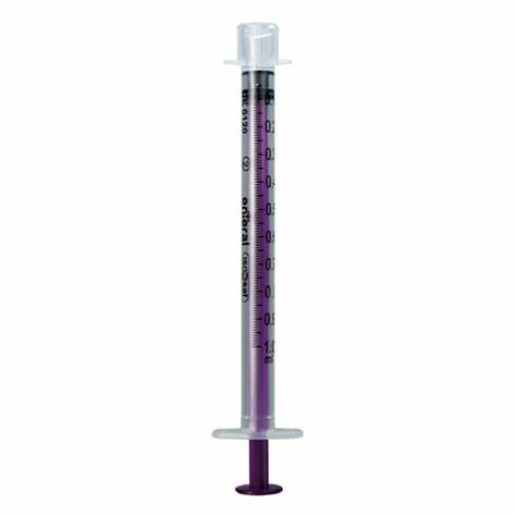 Oral medicine syringe with clear barrel, purple plunger, and measurement markings