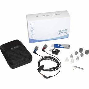 Home hearing test kit with earphones, USB drive, accessories, and carrying case on white background.