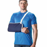 Man wearing a blue shirt and arm sling, orthopedic injury support product