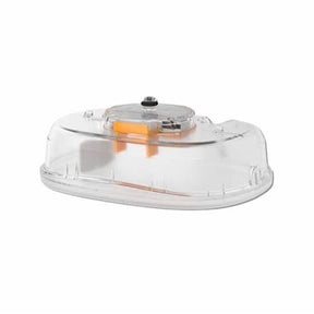 Clear plastic medical device housing with attached orange component on white background