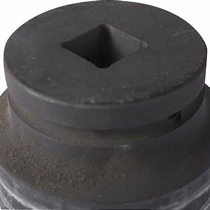 Close-up of a metal socket adapter with a square drive, used for medical equipment assembly