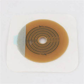 Adhesive ostomy barrier with cut-to-fit center for medical stoma care on white background