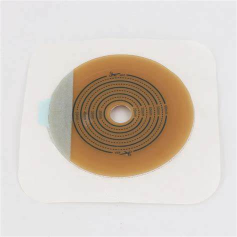 Adhesive ostomy barrier with cut-to-fit center for medical stoma care on white background