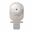Ostomy bag with skin barrier, medical adhesive, and drainable pouch on white background