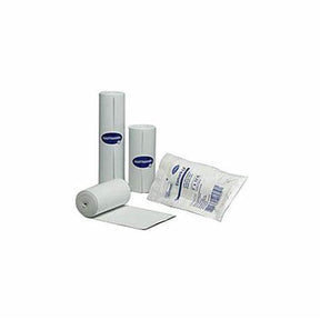 White medical gauze rolls and packaged sterile dressing on white background