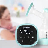 Electric breast pump with digital display, mother holding baby in background