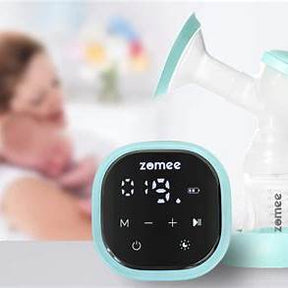 Electric breast pump with digital display, mother holding baby in background