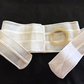 White ostomy support belt with circular opening for medical use on black background