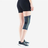Person wearing a compression knee sleeve for joint support and pain relief