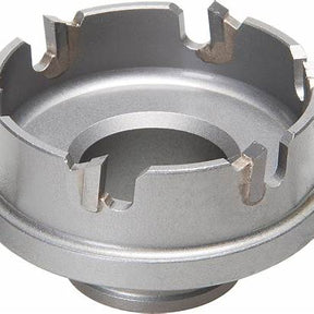 Close-up of a metal rotary tool component with notched grooves, on white background