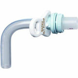 Curved tracheostomy tube with white flange and clear plastic cannula for airway support