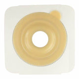 Ostomy barrier with adhesive backing and central opening for medical supplies