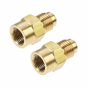 Pair of brass threaded adapters for medical equipment on white background