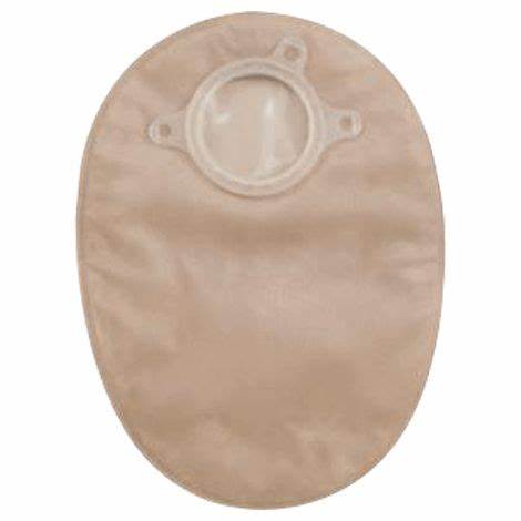 Beige ostomy pouch with circular flange for stoma, medical supply product on white background.