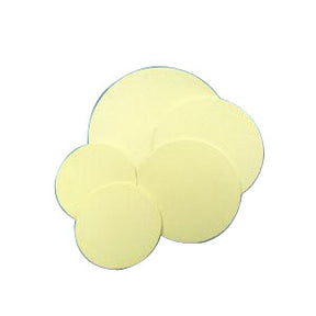Multiple circular beige adhesive patches for medical use on a white background
