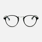 Black round reading glasses with clear lenses on a white background