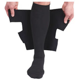 Person applying black lower leg compression wrap over compression sock