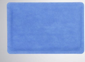 Blue disposable medical underpad on a light background