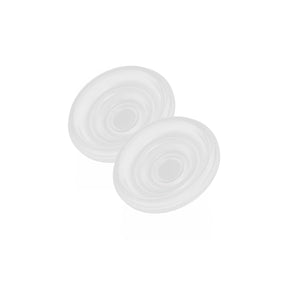 Set of two round silicone breast pump diaphragms on a white background