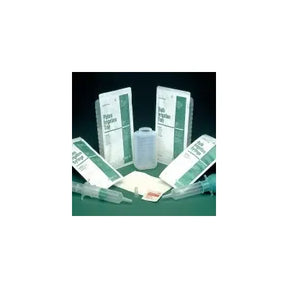 Medical irrigation tray set with syringes, measuring cup, and packaged supplies on dark background
